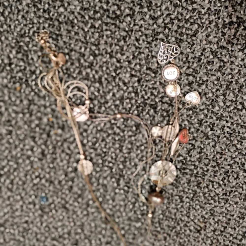Necklace with heart and others charms on it
